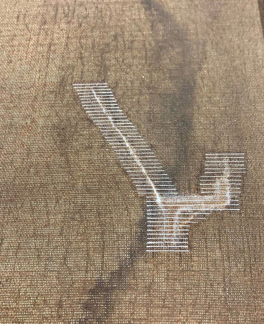 Tear-mending a textile painting with Japanese tissue